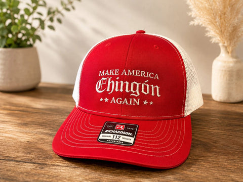 Red Richardson 112 trucker hat with white “Make America Chingón Again” embroidered design and adjustable snapback. Professionally embroidered by WTX Stitches.
