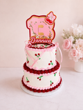 Personalized cherry bow 3D shaker cake topper featuring custom name and age with layered cardstock design and acrylic cake stakes for birthday celebrations.