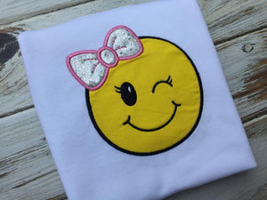 Emoji bow wink face shirt or onesie.