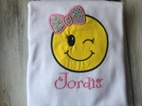 Emoji bow wink face shirt or onesie.